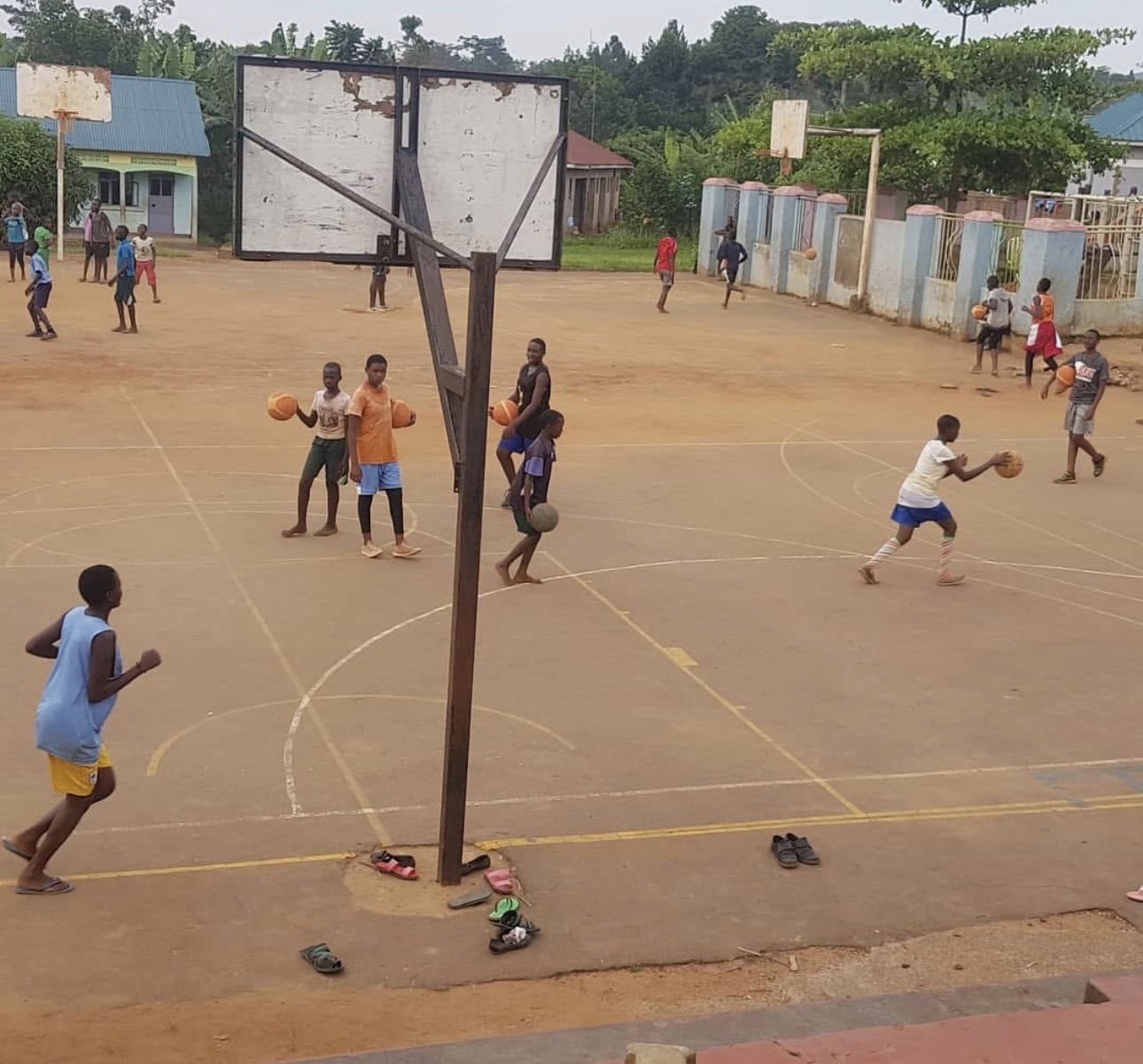 Kids playing pickup basketball on the outdoor court